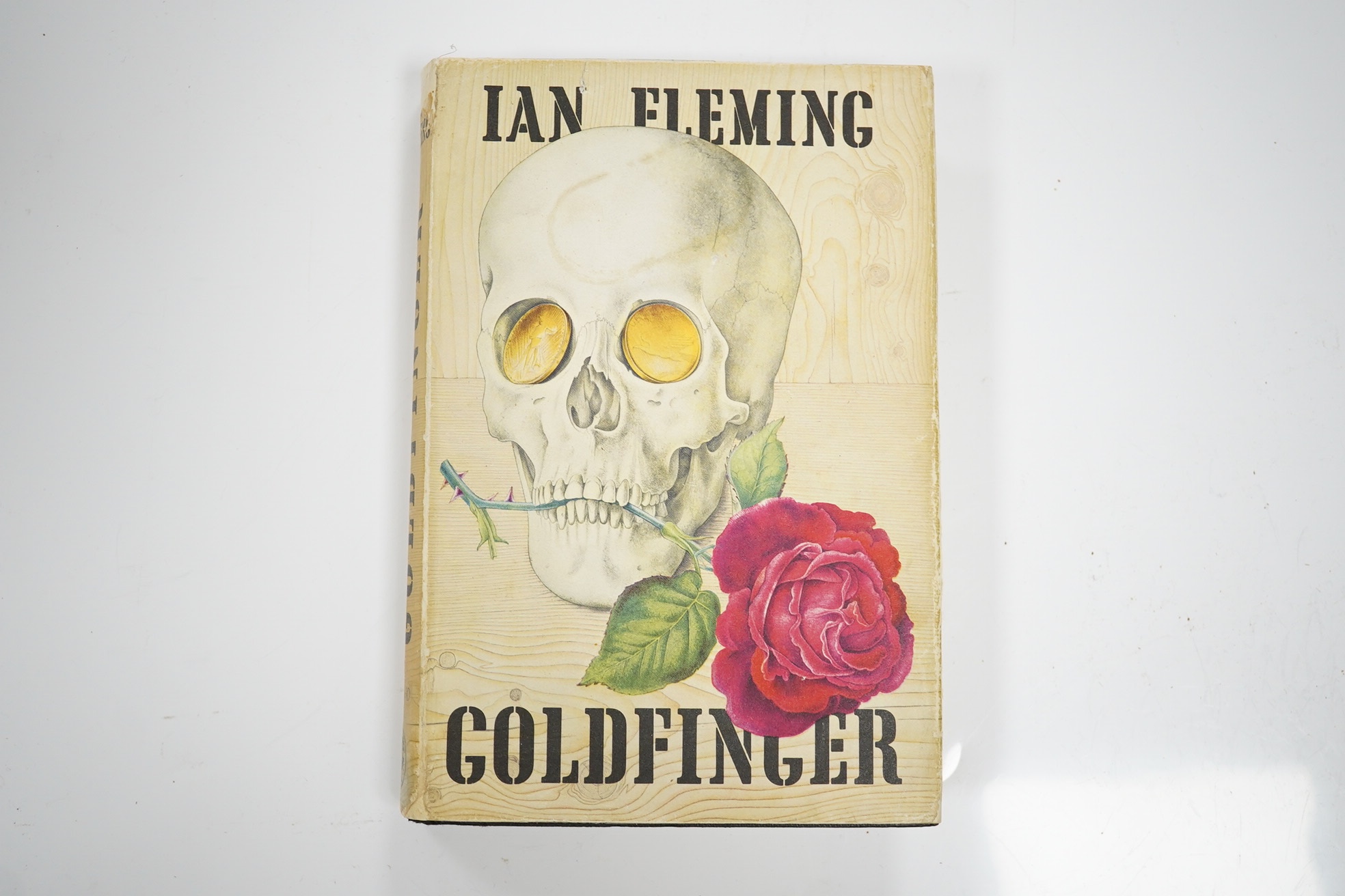 Fleming, Ian - Goldfinger. First Edition (1st impression, 2nd issue). pictorial text map, half title; publisher's black cloth, upper cover blocked in pictorial gilt and blind, d/wrapper. 1959